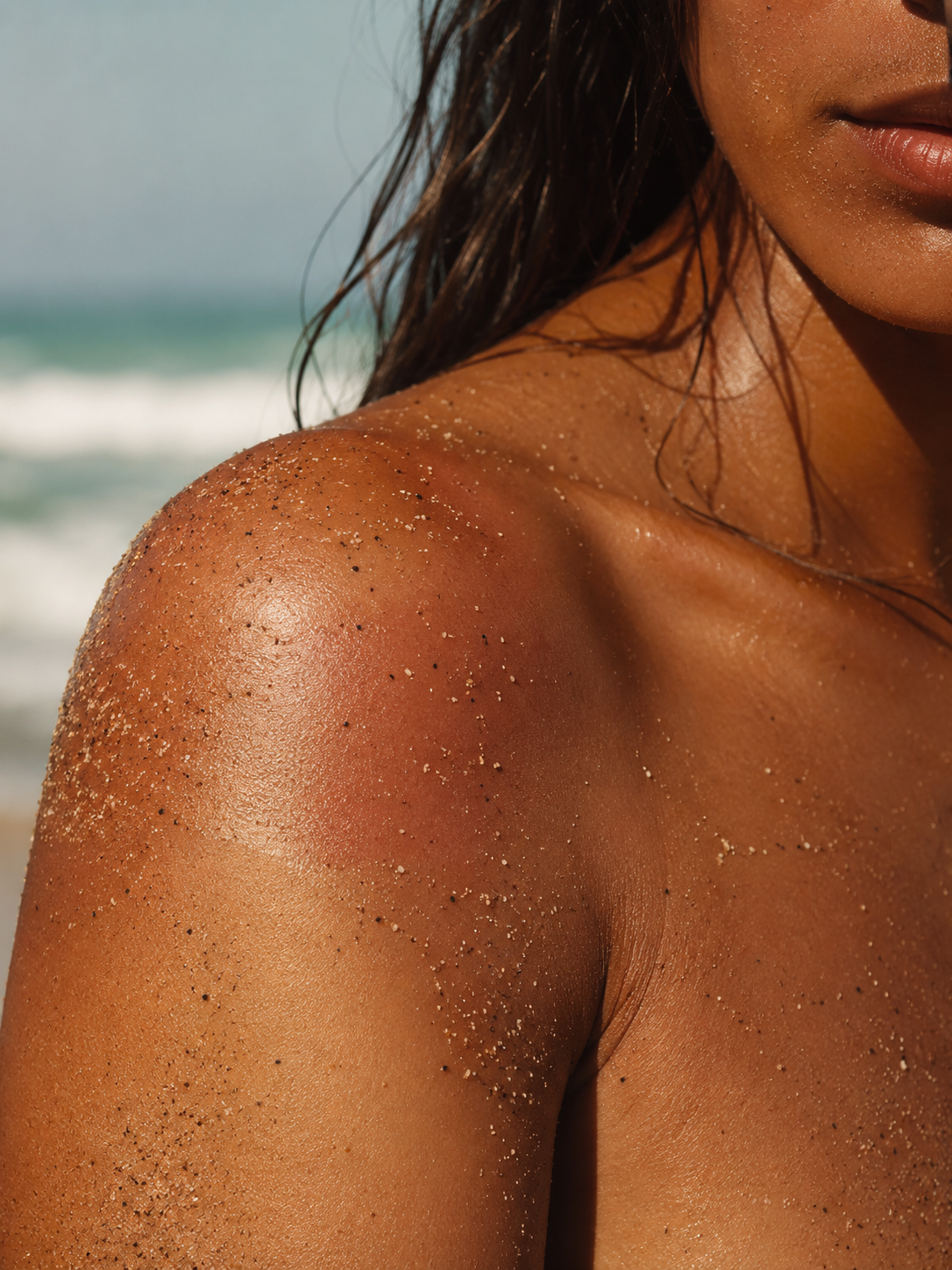 Sunlit skin with traces of sand